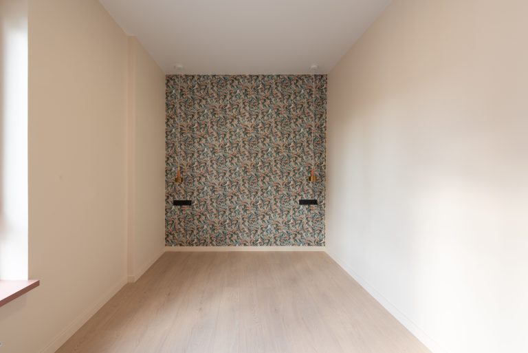 Pale wood-look laminate flooring in an empty Alabama room