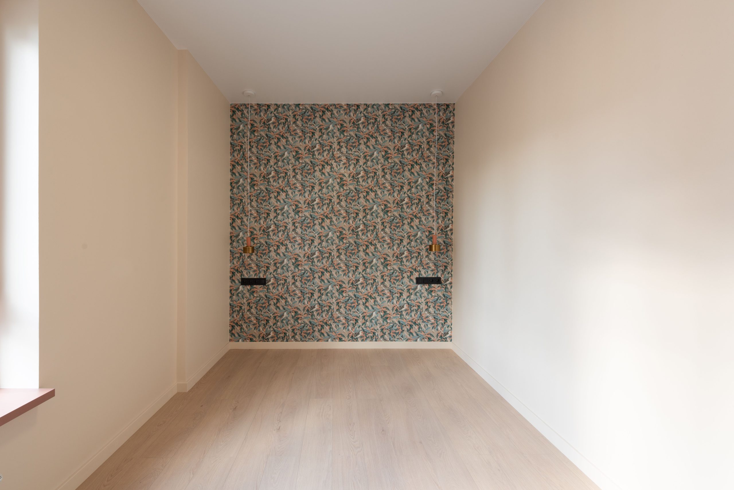 Pale wood-look laminate flooring in an empty Alabama room